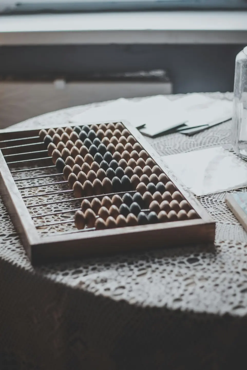 a close up of a table with a glass of water